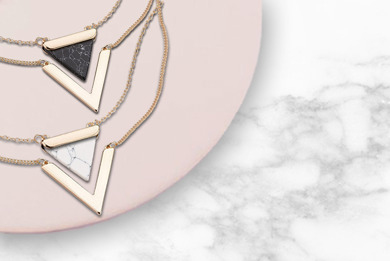 €8 instead of €39.81 (from Alvi's Fashion) for a marble-effect double-layered necklace - choose black or white and save 80%